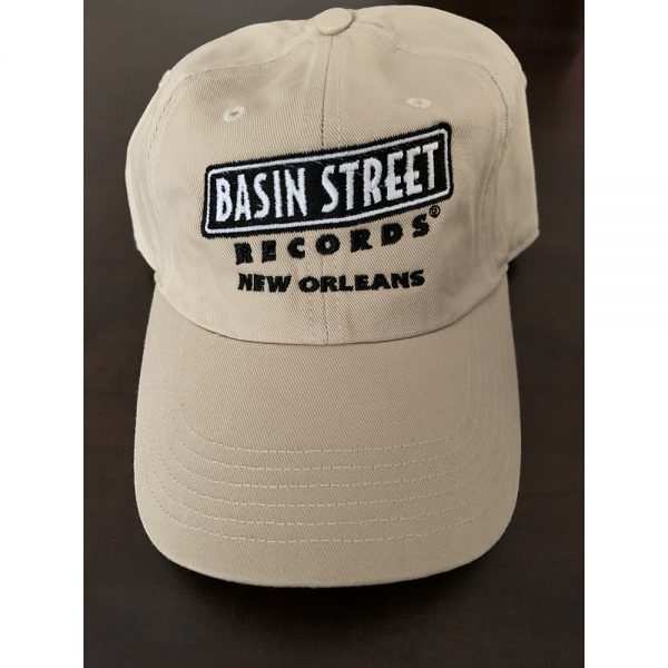Golf/"Dad" hat style cap in stone color (khaki/beige) with embroidered basin street records logo in black on front